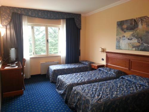 Postel nebo postele na pokoji v ubytování Albergo Costantini
