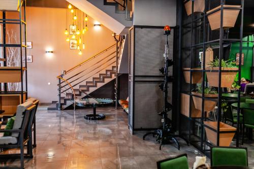a room with a camera and a staircase at Aleanda in Chernivtsi