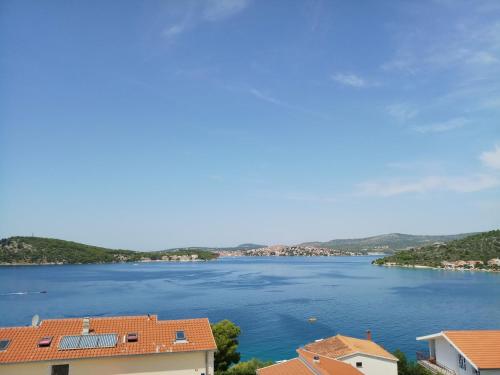 a view of a lake with houses and buildings at Holiday Apartment Lucic - SEA VIEW - Peaceful - Family Friendly - Near Beach in Ražanj