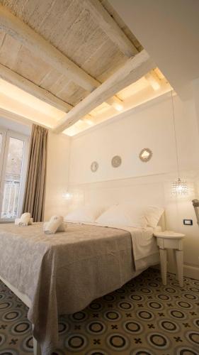 a bedroom with a large bed and a window at BellaVita accomodation in Tropea