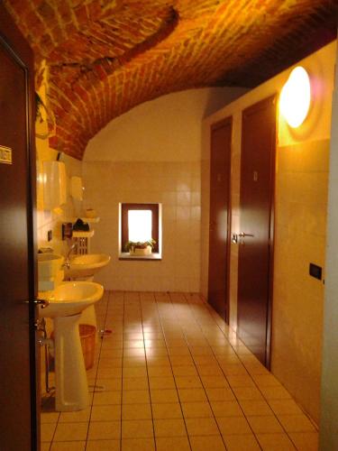 a bathroom with a sink and a toilet at Cascina Roland in Villar Focchiardo