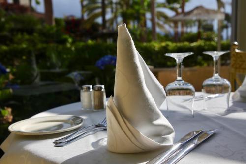 a white napkin sitting on top of a table at Hotel Puerto Palace in Puerto de la Cruz