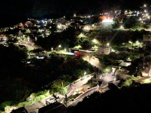 an aerial view of a city at night at 九窩Jiu Wow Box Inn Jiufen九份 in Jiufen