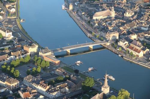 an overhead view of a city with a bridge and a river at Ancienne Fermette le Charlemont Givet Foisches in Foisches