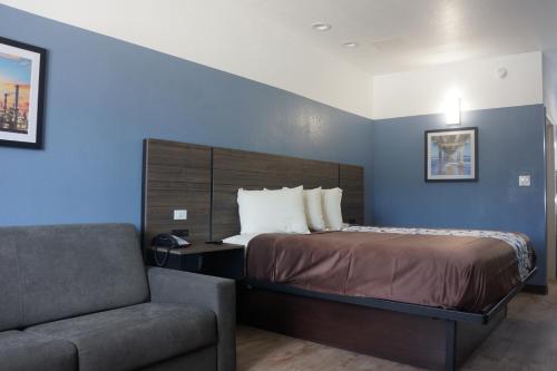 Voodi või voodid majutusasutuse Texan Hotel toas