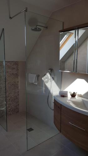 a bathroom with a shower and a sink at Tündérlak Vendégház in Balatonfüred