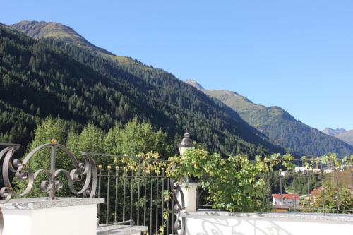 a balcony with a view of a mountain at Landhaus Lechthaler in Sankt Anton am Arlberg