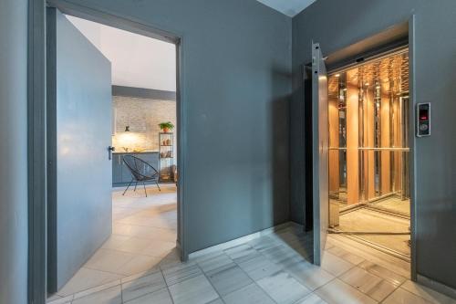 an open door leading to a hallway with a room at Boutique Studios & Apartments - by Avelink in Spáta