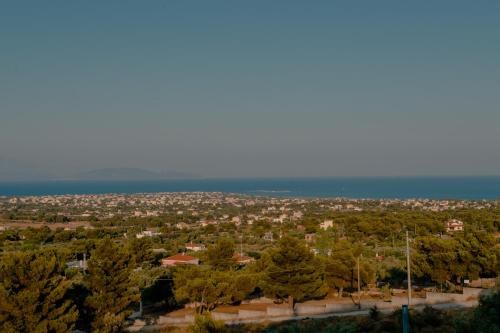 an aerial view of a city with trees at Helios Residence in Spáta