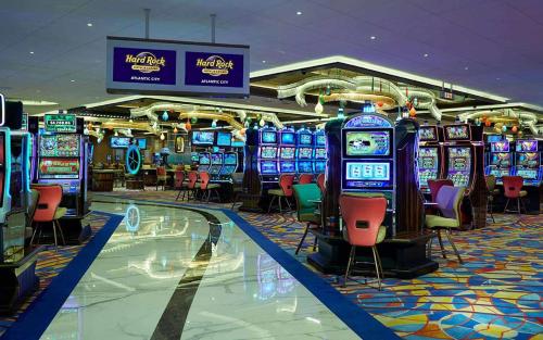 a casino filled with lots of slot machines at Hard Rock Hotel & Casino Atlantic City in Atlantic City