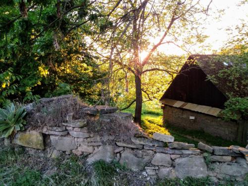 an old stone wall next to a stone house at Apartmá Za kopcem in Boskovice
