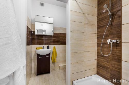a bathroom with a toilet and a sink and a shower at Prime Home CENTRUM 1 in Gdynia