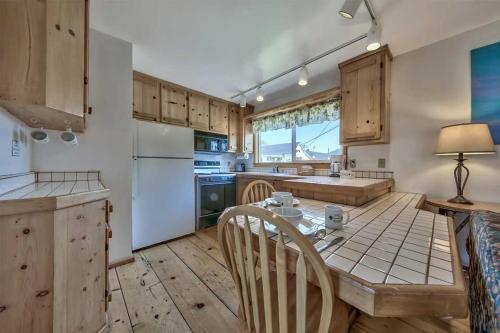 a kitchen with a table and chairs in a room at Silver Maple Inn and The Cain House Country Suites in Bridgeport