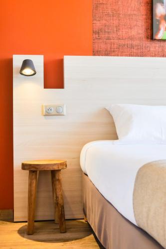 Una cama o camas en una habitación de Gondwana City Green