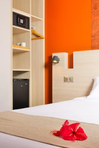 Una cama o camas en una habitación de Gondwana City Green