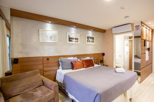A bed or beds in a room at Flat Vision Hoteleiro Norte