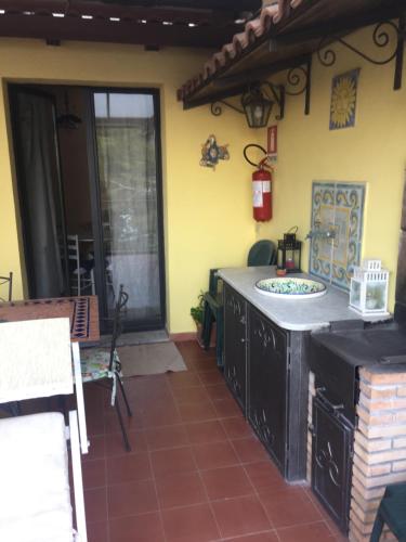 a kitchen with a counter in a house at ToviMar Apartments in Taormina