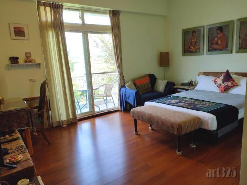 A bed or beds in a room at Yi Tian Homestay