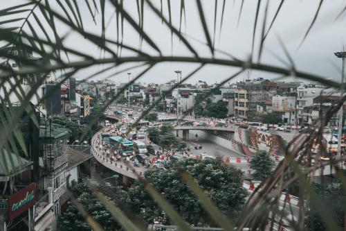 a view of a busy city street with traffic at Hanoi Fiesta Hotel & Spa in Hanoi