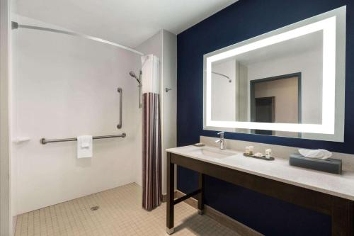 a bathroom with a sink and a mirror at La Quinta by Wyndham Rock Hill in Rock Hill