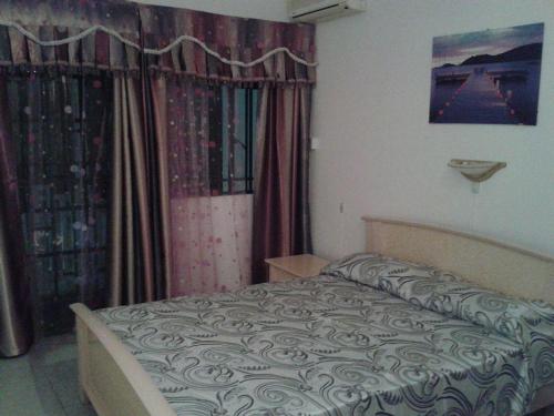 Postel nebo postele na pokoji v ubytování Beach Front Bungalow- Flic en Flac
