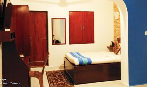 Ένα ή περισσότερα κρεβάτια σε δωμάτιο στο Serene Waters Homestay Goa