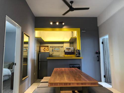 a kitchen with a wooden table in a room at Chill Chill House in Shimen