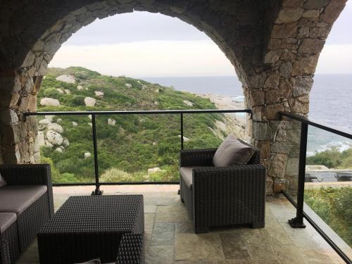 a room with a view of the ocean at Castelia in Lumio