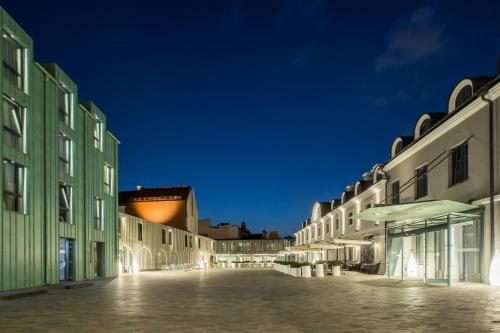 an empty street in a city at night at Hotel Pacai, Vilnius, a Member of Design Hotels in Vilnius