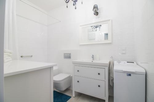 Ванная комната в Gdansk De Lux Apartament z ogrodem