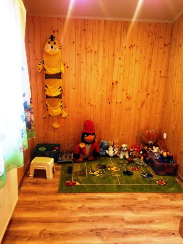 a corner of a room with stuffed animals on the floor at U Wujcia in Wisła