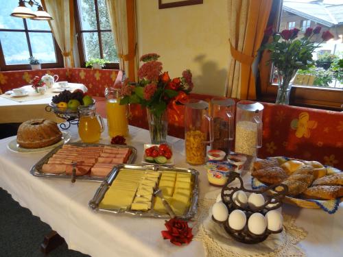a table with food and eggs and bread on it at Pension Appartements Reithof in Sankt Johann im Pongau