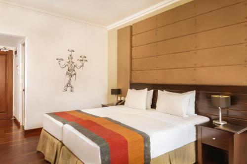 Posteľ alebo postele v izbe v ubytovaní Kandy City Hotel by Earl's