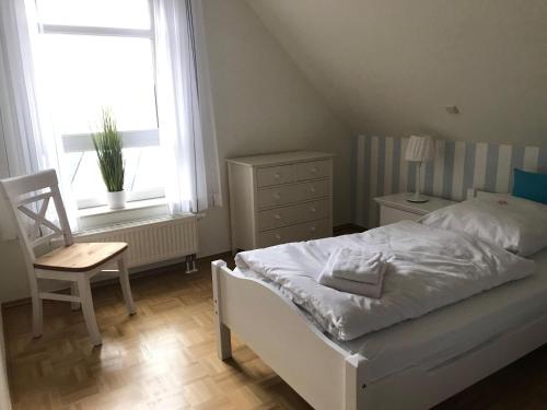 Postel nebo postele na pokoji v ubytování Haus-Silbermoeve