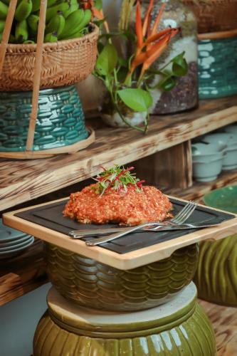 a plate of food sitting on top of a table at Thang Long Opera Hotel in Hanoi