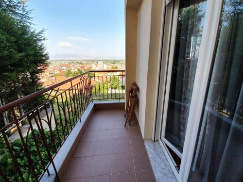 a balcony with a view of a city at Philippos House in Florina