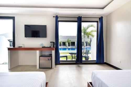 Postel nebo postele na pokoji v ubytování OHANA, Panglao Resort.