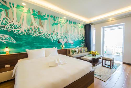 a bedroom with a large bed and a large painting of birds at Nexy Living in Hanoi