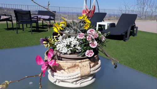 a basket filled with flowers sitting on a table at Cascina Roella in Monforte dʼAlba