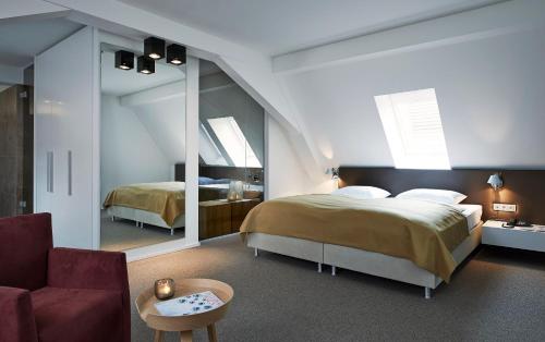 מיטה או מיטות בחדר ב-Weinhaus Henninger