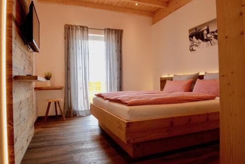 En eller flere senge i et værelse på Schmid’s Ferienwohnungen