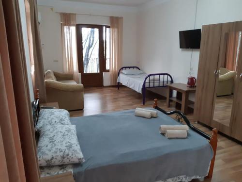 Postel nebo postele na pokoji v ubytování Hotel Niko