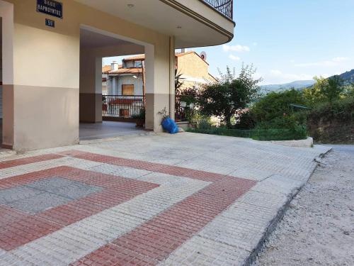 an outside view of a building with a patio at Philippos House in Florina
