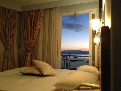 Ένα ή περισσότερα κρεβάτια σε δωμάτιο στο Souris Hotel 