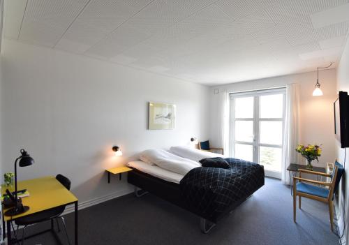 Säng eller sängar i ett rum på Hotel Schaumburg