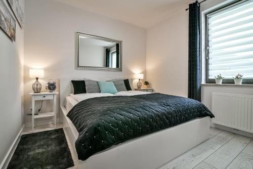 Posteľ alebo postele v izbe v ubytovaní Old Town LTC - Apartments Starówka Panieńska