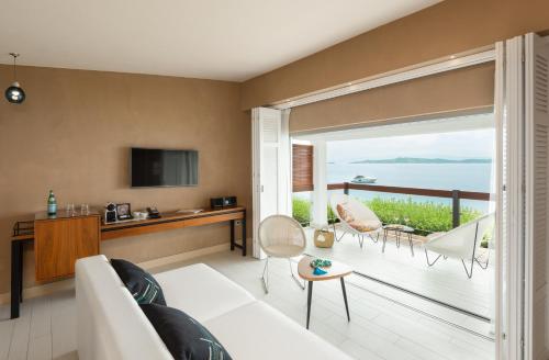 a living room with a view of the ocean at Eagles Palace in Ouranoupoli