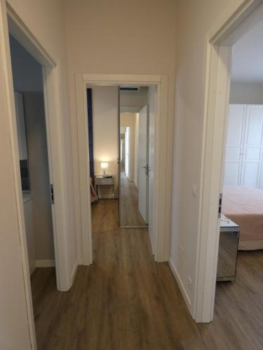 an empty room with a bed and a hallway at Villa Allende in Forte dei Marmi in Forte dei Marmi