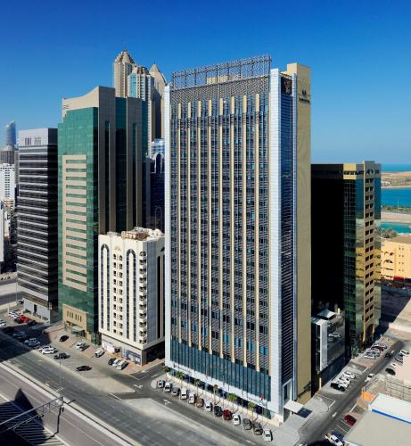 a group of tall buildings in a city at Southern Sun Abu Dhabi in Abu Dhabi