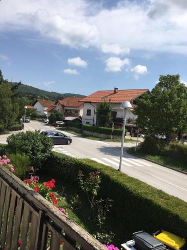 a view of a street with a car driving down the road at Odisey in Postojna